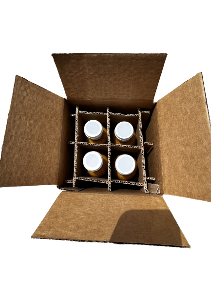 4 bottles of Chicago Fire Sauce in a box being shipped